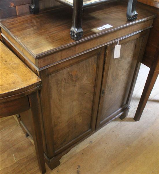 Mahogany low cupboard, enclosed by a pair of panelled doors(-)